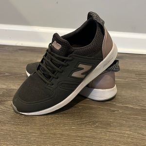 Gray and rose gold New Balance shoes